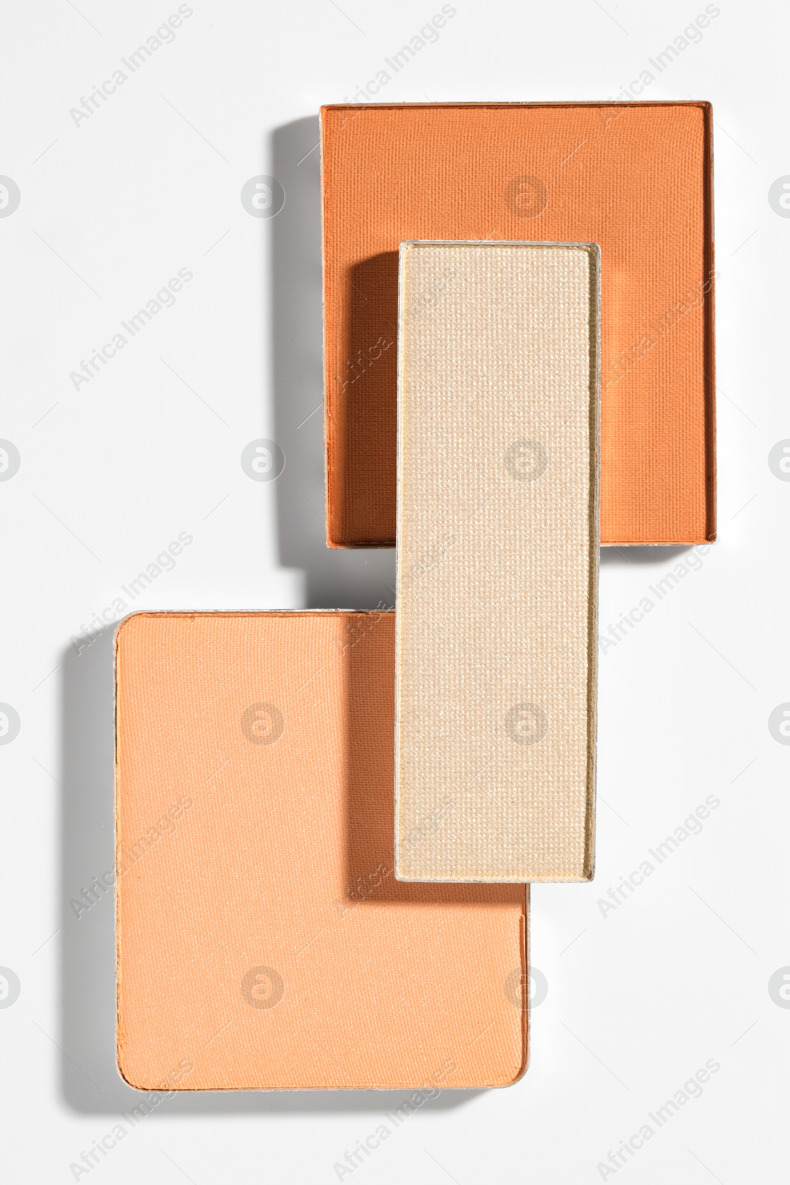 Beautiful eyeshadow refill pans on white background, flat lay Photo of Beautiful eyeshadow refill pans on white background, flat lay