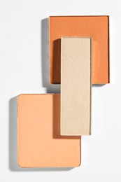 Photo of Beautiful eyeshadow refill pans on white background, flat lay