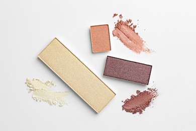 Photo of Beautiful eyeshadow refill pans on white background, flat lay