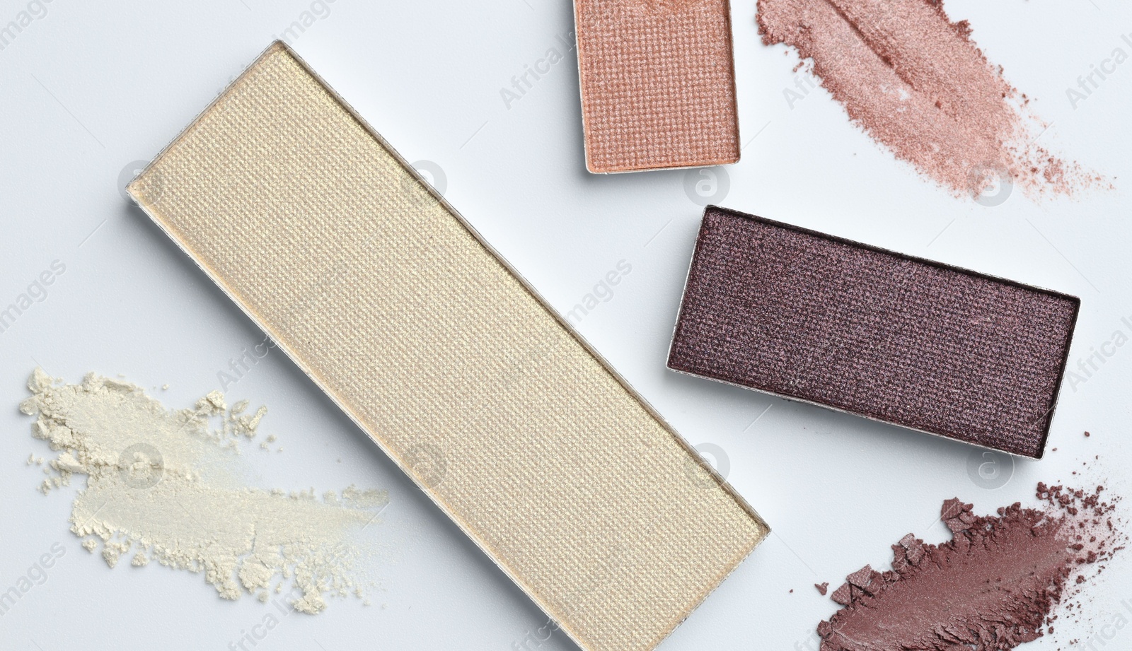 Beautiful eyeshadow refill pans on white background, flat lay Photo of Beautiful eyeshadow refill pans on white background, flat lay