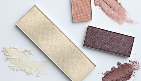 Photo of Beautiful eyeshadow refill pans on white background, flat lay