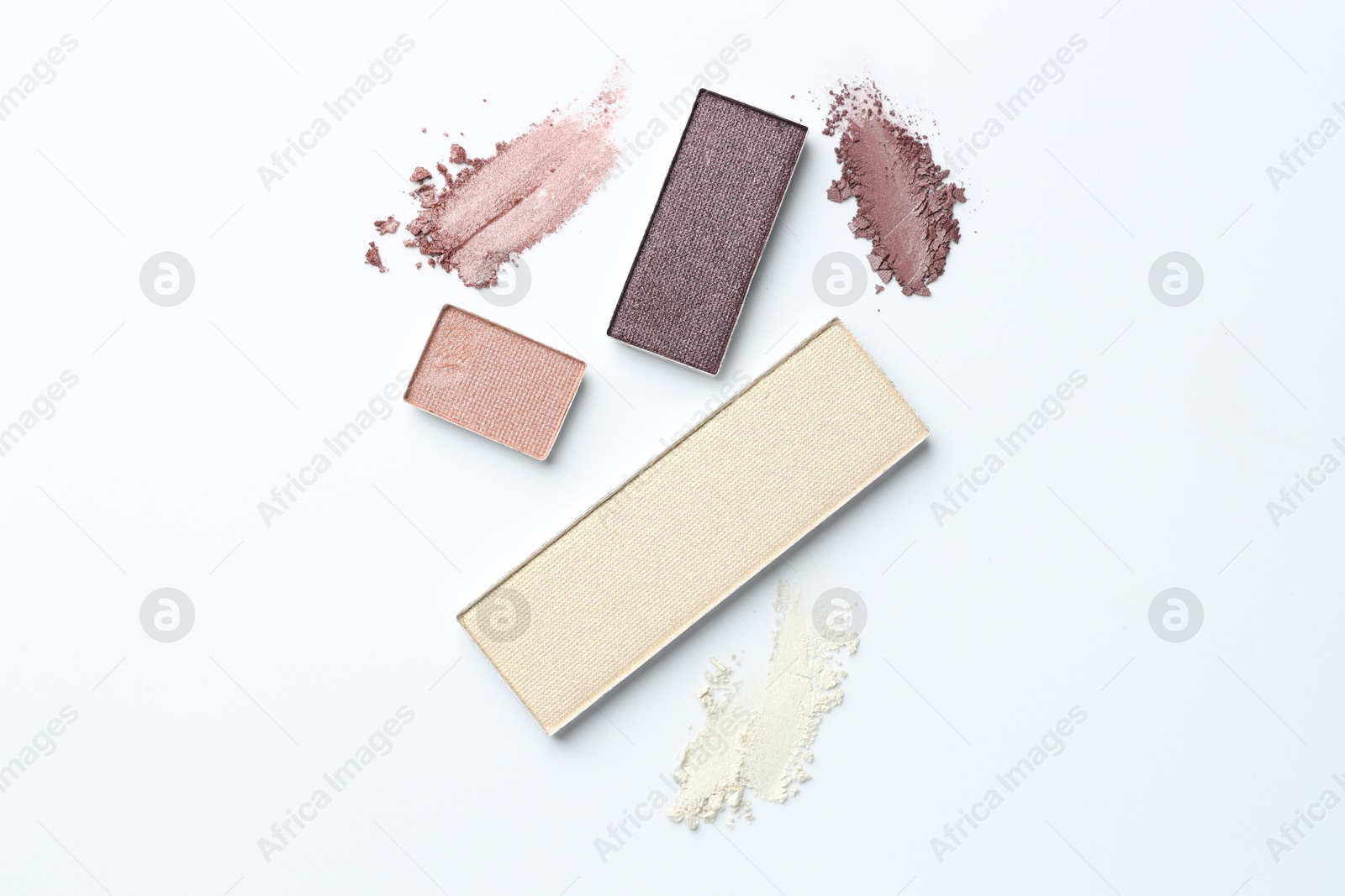 Beautiful eyeshadow refill pans on white background, flat lay Photo of Beautiful eyeshadow refill pans on white background, flat lay
