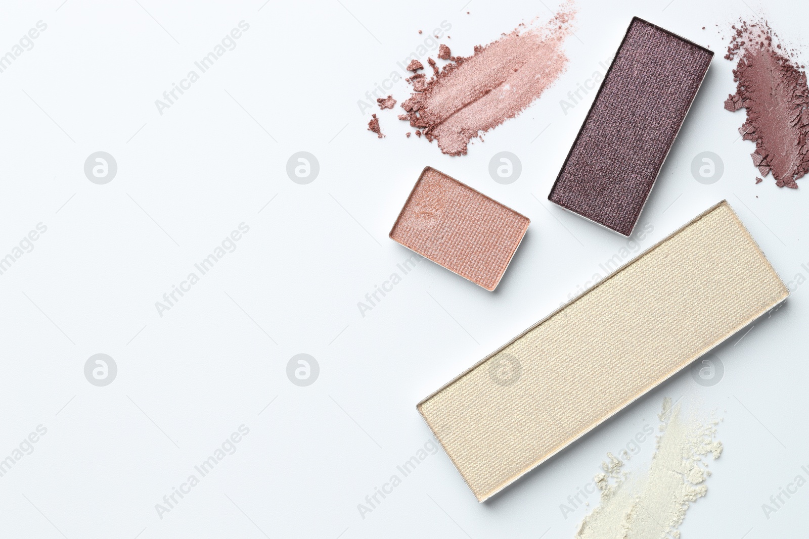 Beautiful eyeshadow refill pans on white background, flat lay. Space for text Photo of Beautiful eyeshadow refill pans on white background, flat lay. Space for text