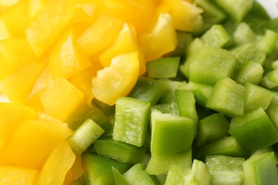 Photo of Pieces of fresh colorful bell peppers as background, closeup