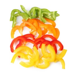 Photo of Slices of fresh colorful bell peppers isolated on white, above view