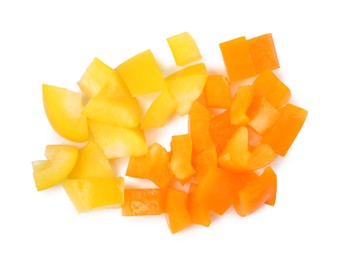 Photo of Pieces of fresh colorful bell peppers isolated on white, top view