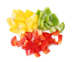 Photo of Pieces of fresh colorful bell peppers isolated on white, top view