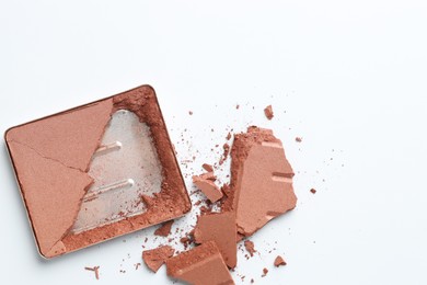 Photo of Broken eyeshadow refill pan on white background, top view. Space for text