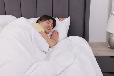 Photo of Beautiful woman sleeping in bed at home