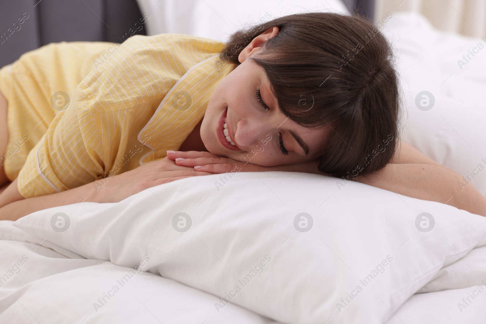 Beautiful woman sleeping in bed at home Photo of Beautiful woman sleeping in bed at home