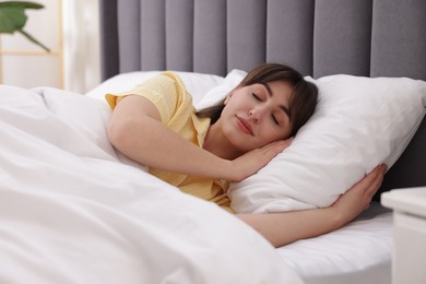 Photo of Beautiful woman sleeping in bed at home