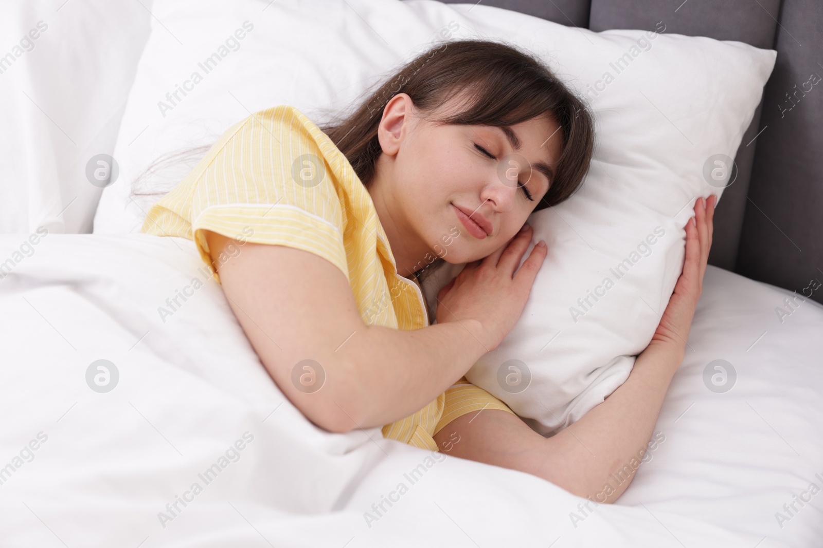 Beautiful woman sleeping in bed at home Photo of Beautiful woman sleeping in bed at home