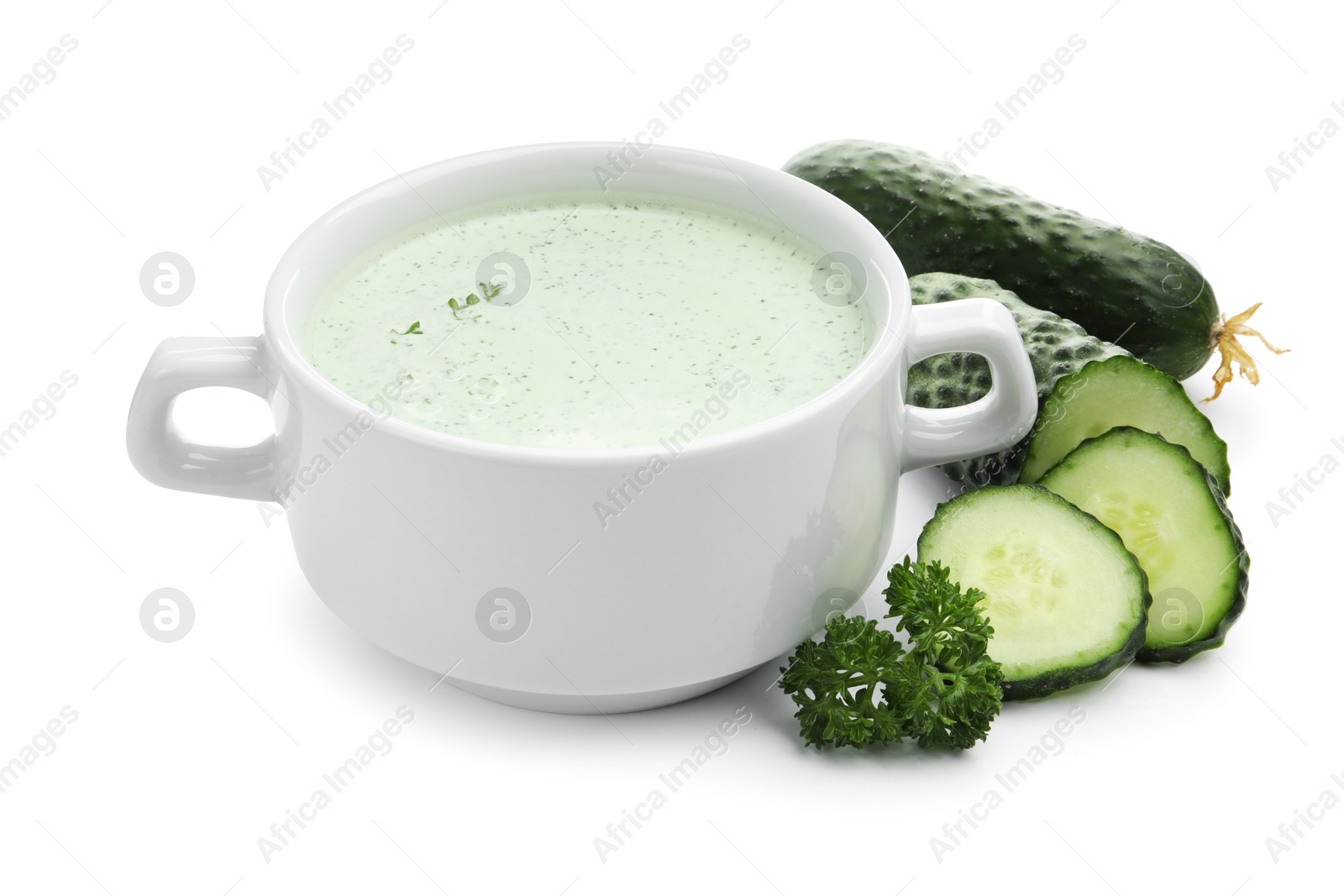 Photo of Tasty cucumber soup and fresh vegetables isolated on white