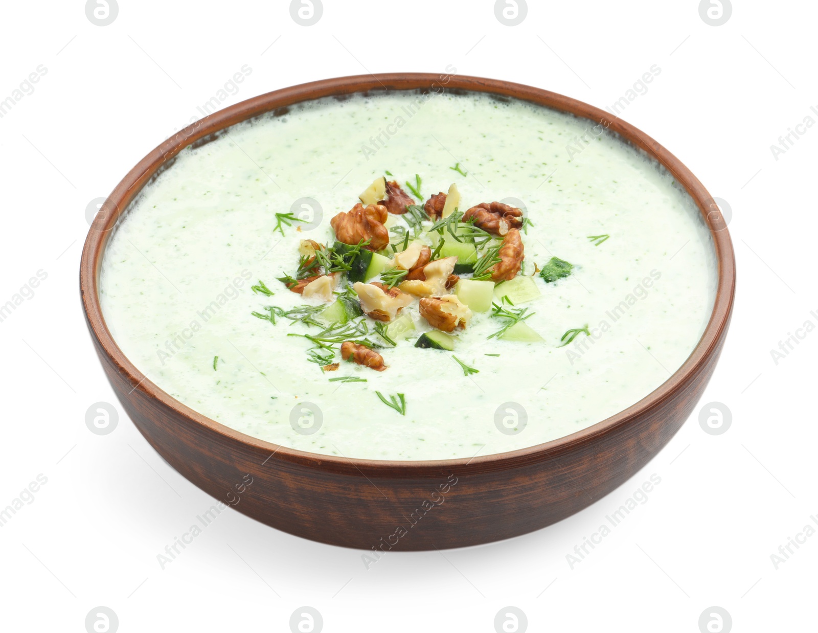 Photo of Tasty cucumber soup with dill and walnuts isolated on white