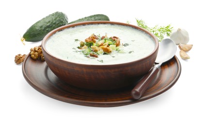 Photo of Tasty cucumber soup with dill, walnuts and ingredients isolated on white