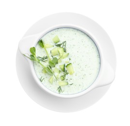 Photo of Tasty cucumber soup with microgreens isolated on white, top view