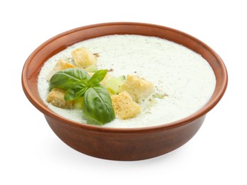 Photo of Tasty cucumber soup with croutons and basil isolated on white