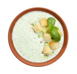 Photo of Tasty cucumber soup with croutons and basil isolated on white, top view