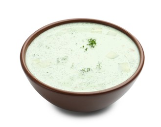 Photo of Tasty cucumber soup with parsley isolated on white
