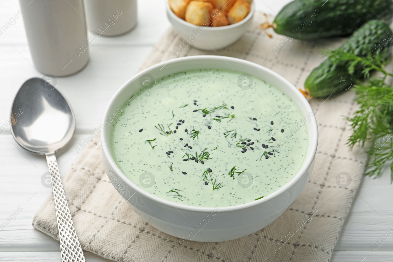 Tasty cucumber soup served on white table, closeup Photo of Tasty cucumber soup served on white table, closeup