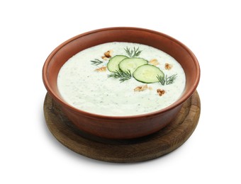 Photo of Tasty cucumber soup with dill and walnuts isolated on white
