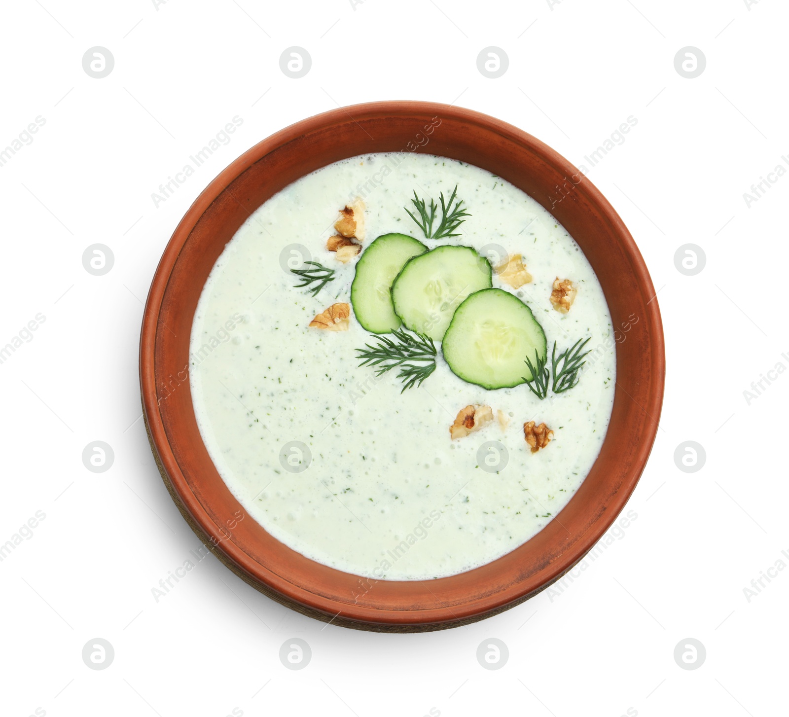 Tasty cucumber soup with dill and walnuts isolated on white, top view Photo of Tasty cucumber soup with dill and walnuts isolated on white, top view