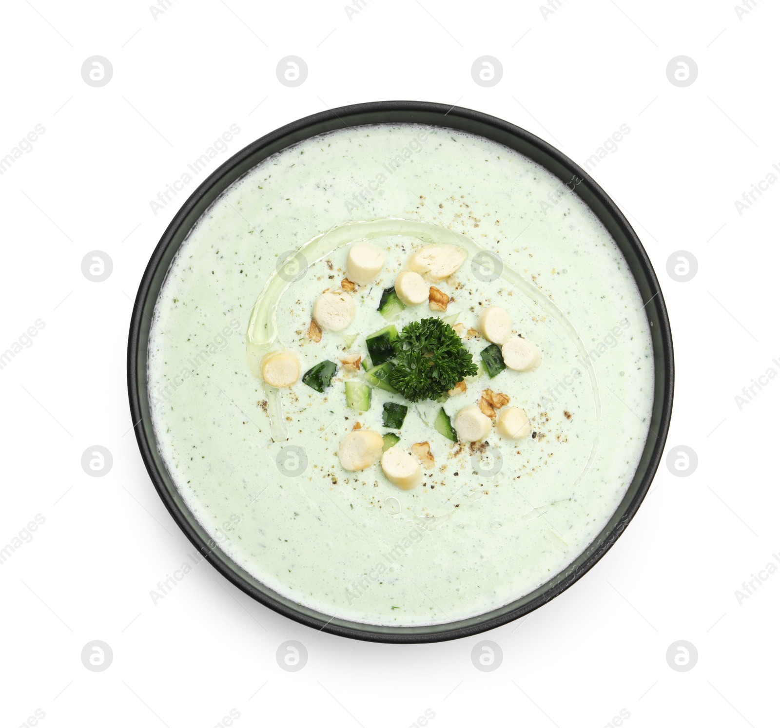 Tasty cucumber soup with croutons and broccoli isolated on white, top view Photo of Tasty cucumber soup with croutons and broccoli isolated on white, top view