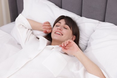 Photo of Beautiful woman sleeping in bed at home