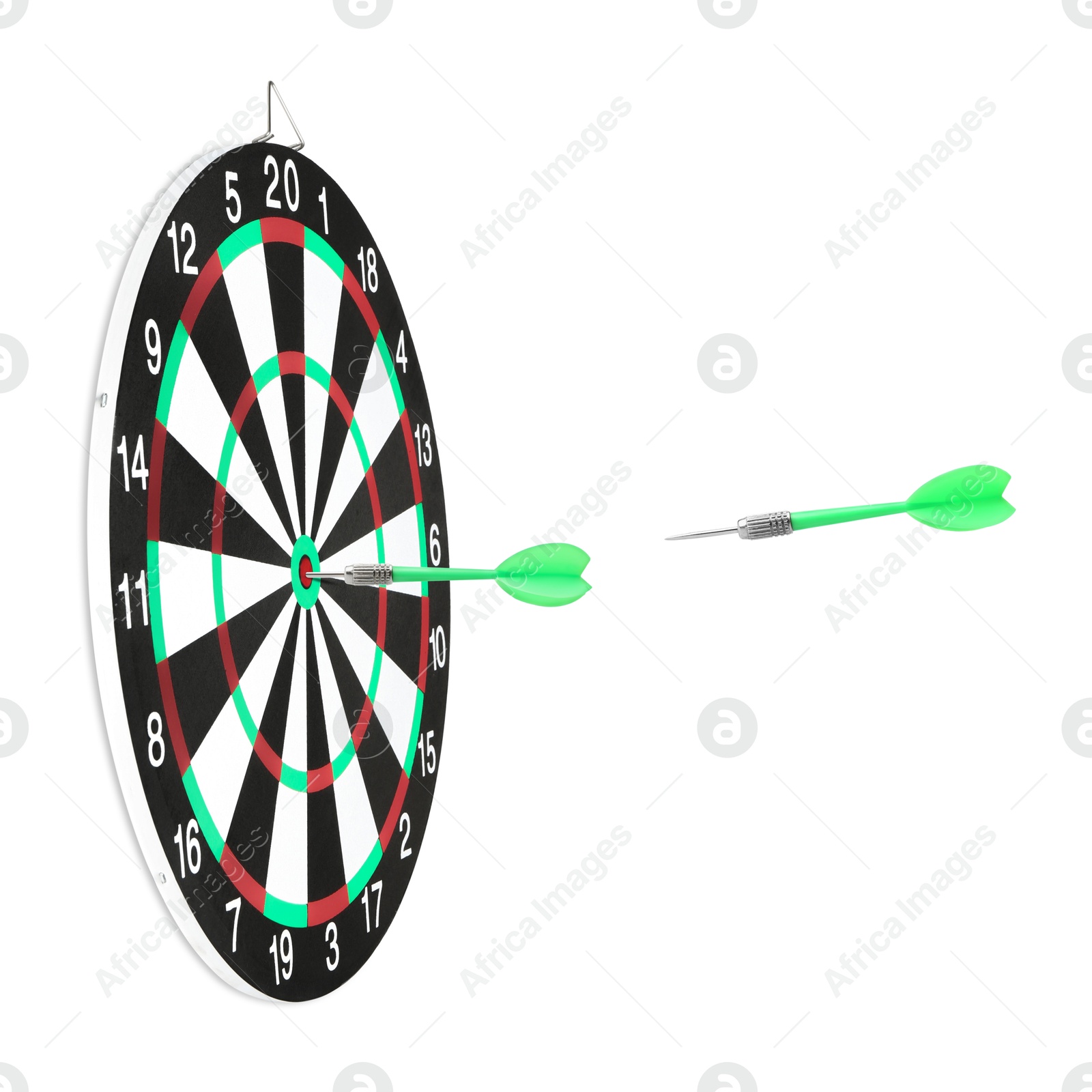 One dart sticking in dartboard and other one flying on white background Image of One dart sticking in dartboard and other one flying on white background