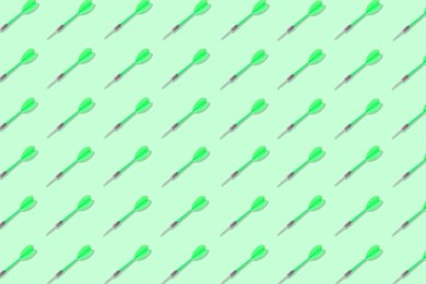 Image of Pattern of darts on light green background