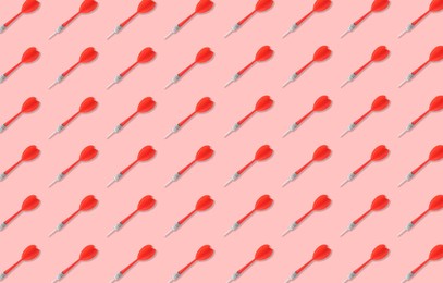 Image of Pattern of darts on light red background
