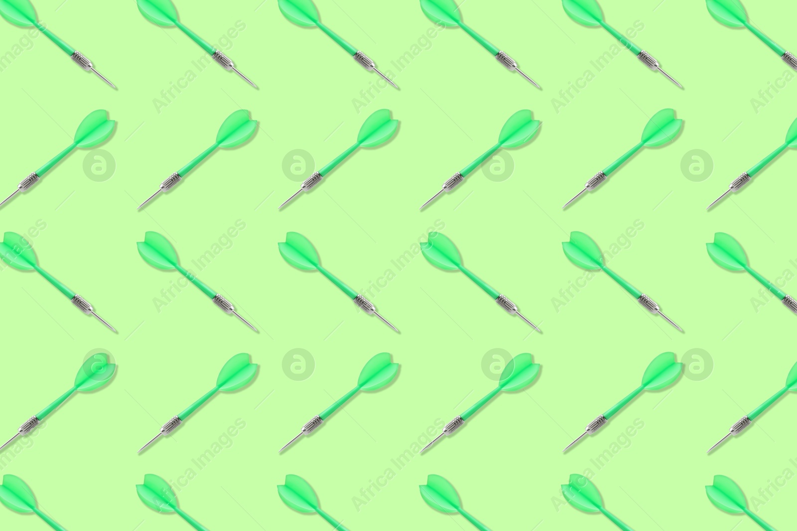 Pattern of darts on light green background Image of Pattern of darts on light green background