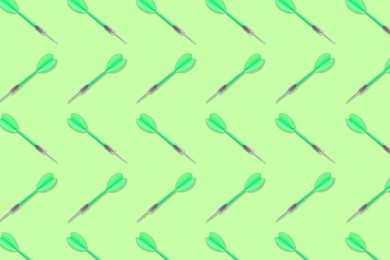 Image of Pattern of darts on light green background