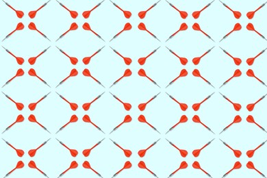 Image of Pattern of darts on light blue background