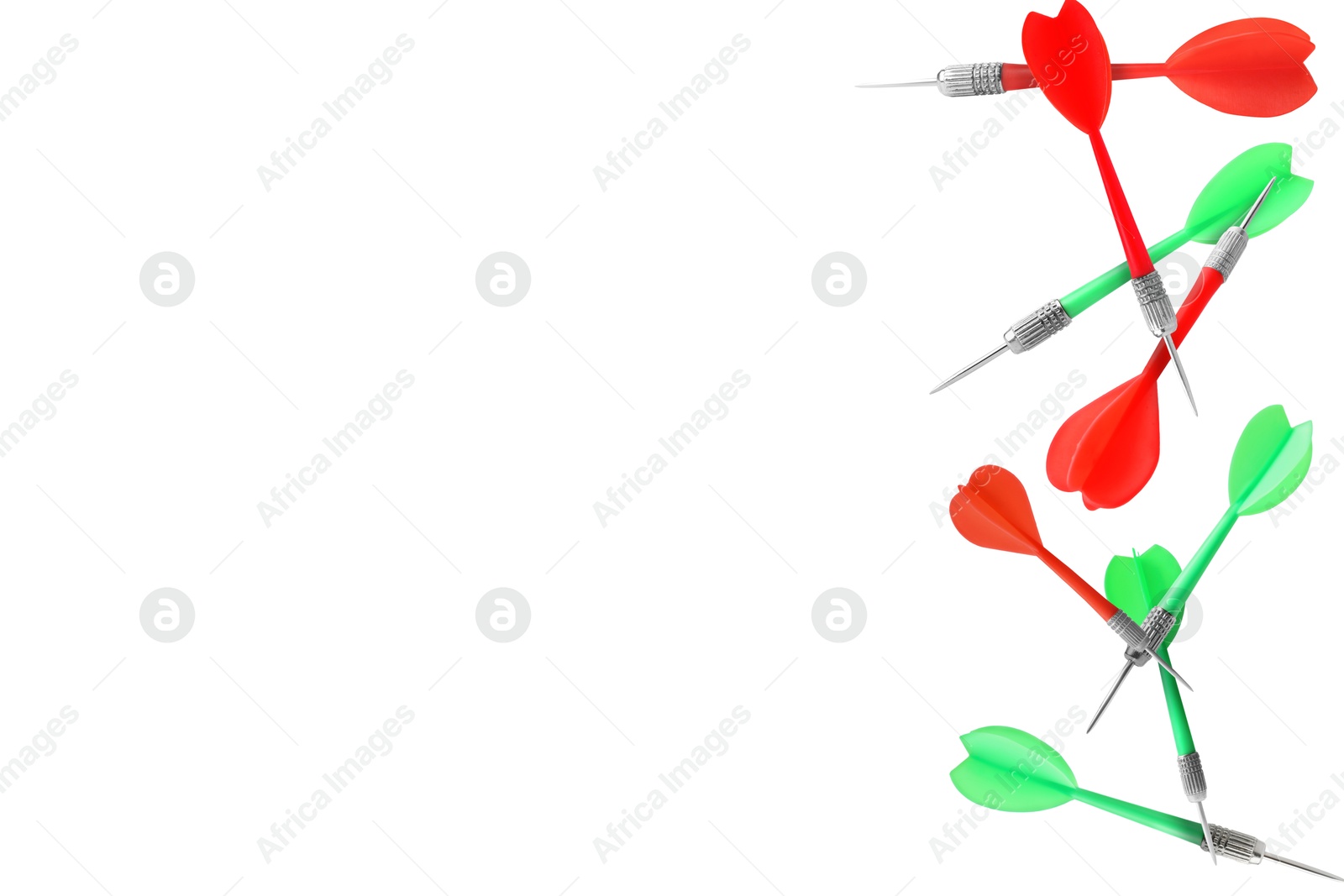 Red and green darts flying on white background Image of Red and green darts flying on white background
