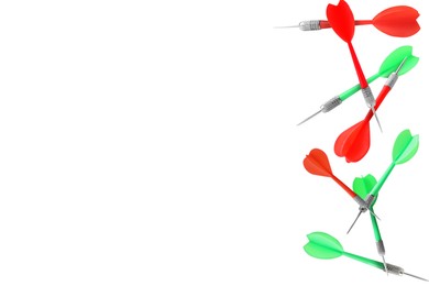 Image of Red and green darts flying on white background