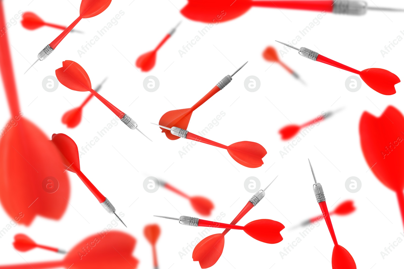Red darts in air on white background Image of Red darts in air on white background