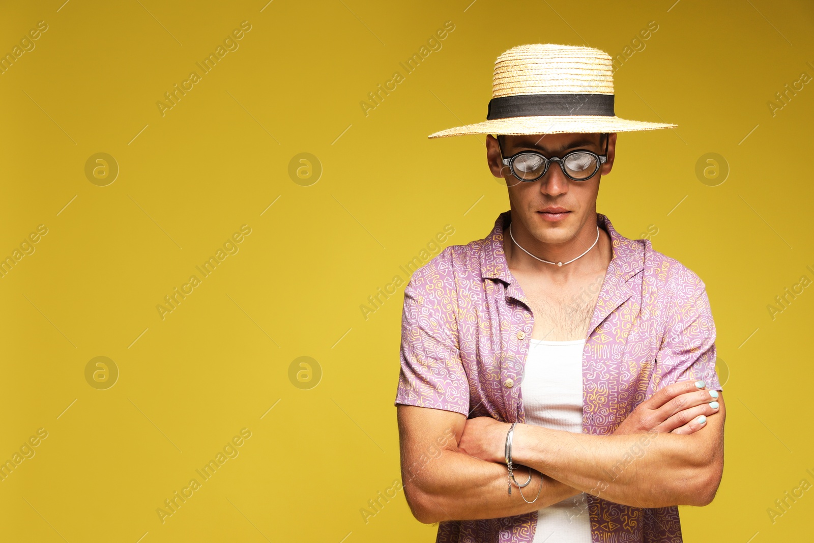 Fashionable portrait of handsome man in stylish outfit on color background, space for text Photo of Fashionable portrait of handsome man in stylish outfit on color background, space for text