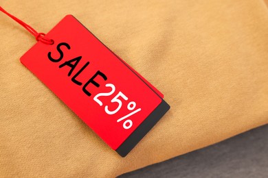 Image of Red Sale tag on clothing, top view