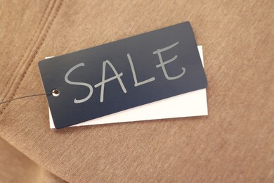 Image of Black Sale tag on clothing, top view