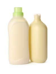 Photo of Bottles of fabric softener isolated on white