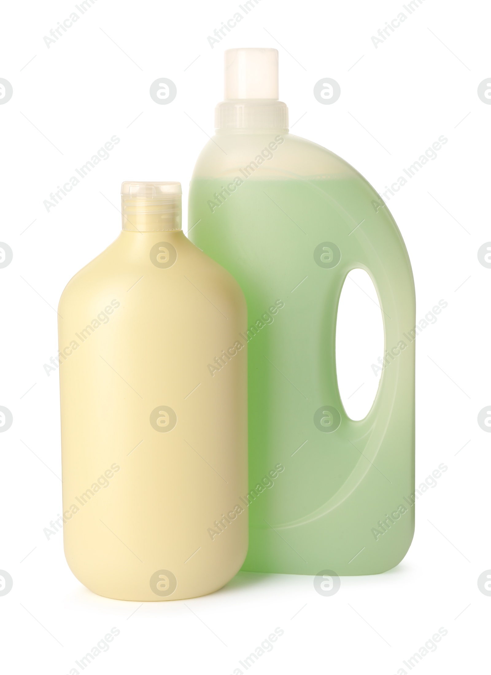 Bottles of fabric softener isolated on white Photo of Bottles of fabric softener isolated on white