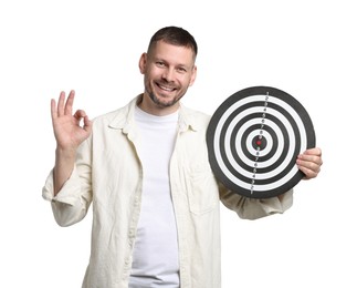 Photo of Targeting. Man with dart board showing ok gesture on white background
