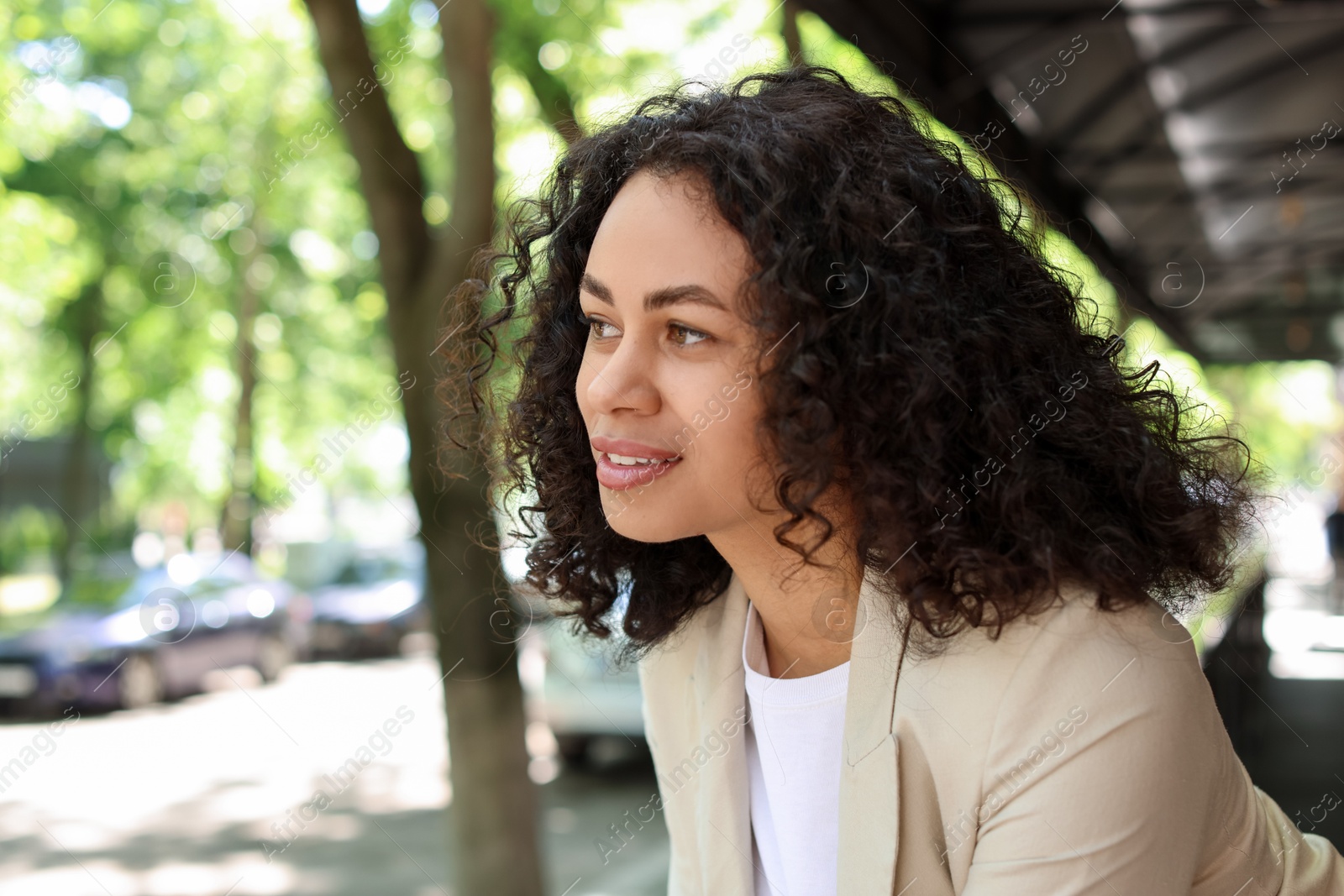 Photo of Portrait of smiling Latin American woman outdoors