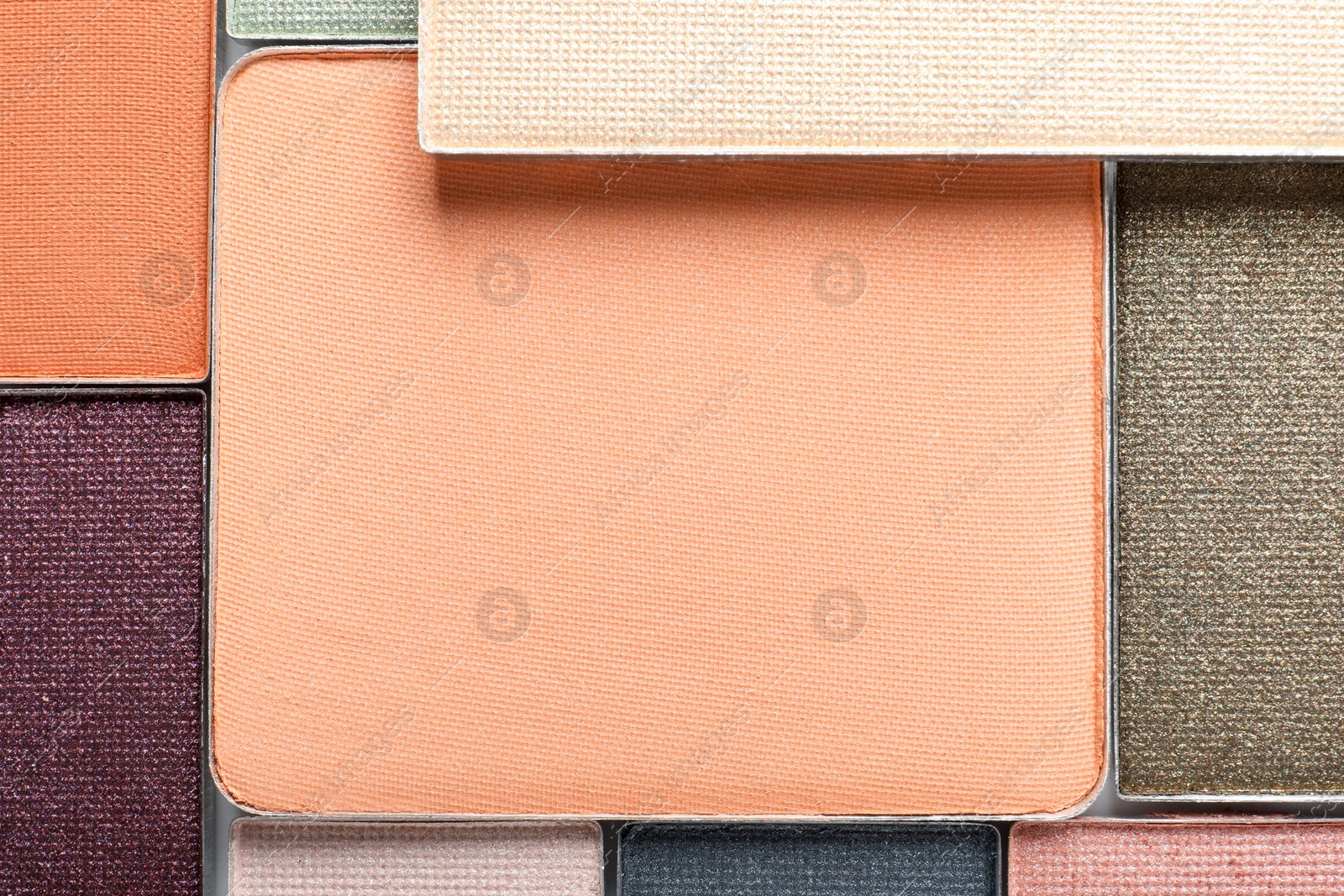 Beautiful eye shadow refill pans as background, top view Photo of Beautiful eye shadow refill pans as background, top view