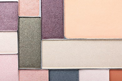 Photo of Beautiful eye shadow refill pans as background, top view