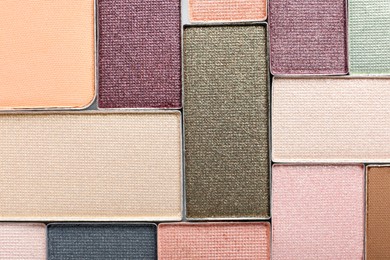 Photo of Beautiful eye shadow refill pans as background, top view
