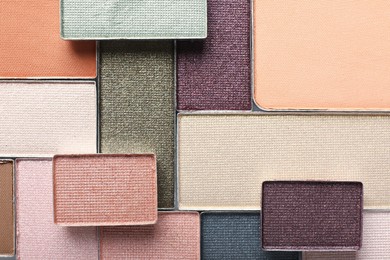 Photo of Beautiful eye shadow refill pans as background, top view