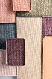 Photo of Beautiful eye shadow refill pans as background, top view