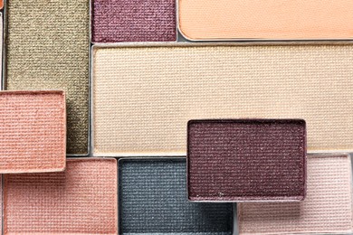 Photo of Beautiful eye shadow refill pans as background, top view
